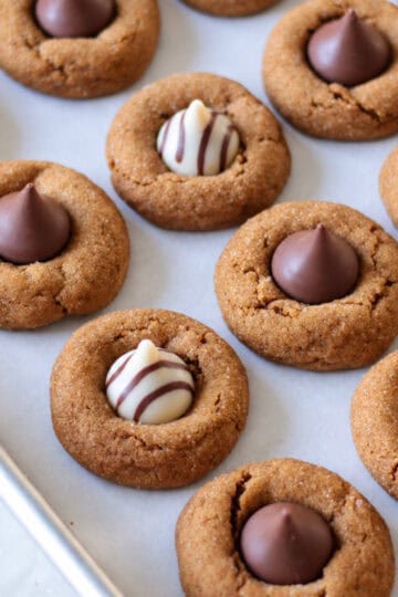 Gingerbread blossoms baked on cookie sheet.