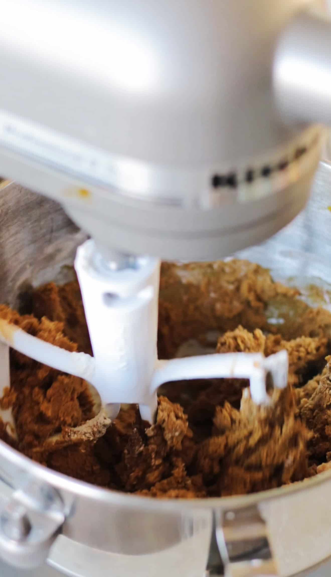 Stand mixer bowl of gingerbread cookie dough.